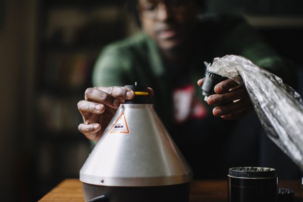 cannabis education | man holding metal container